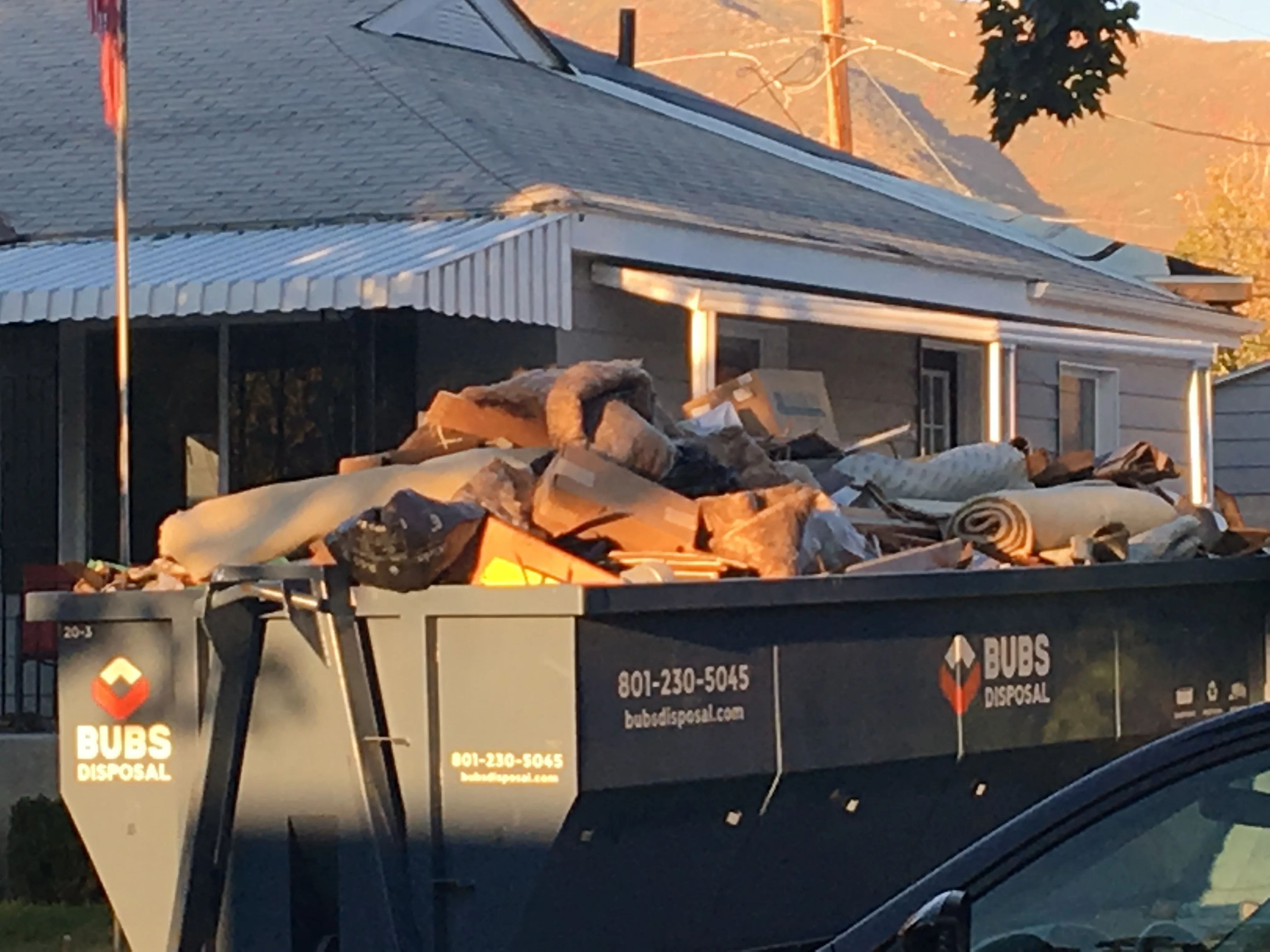 15 yard roll-off dumpster on residential driveway