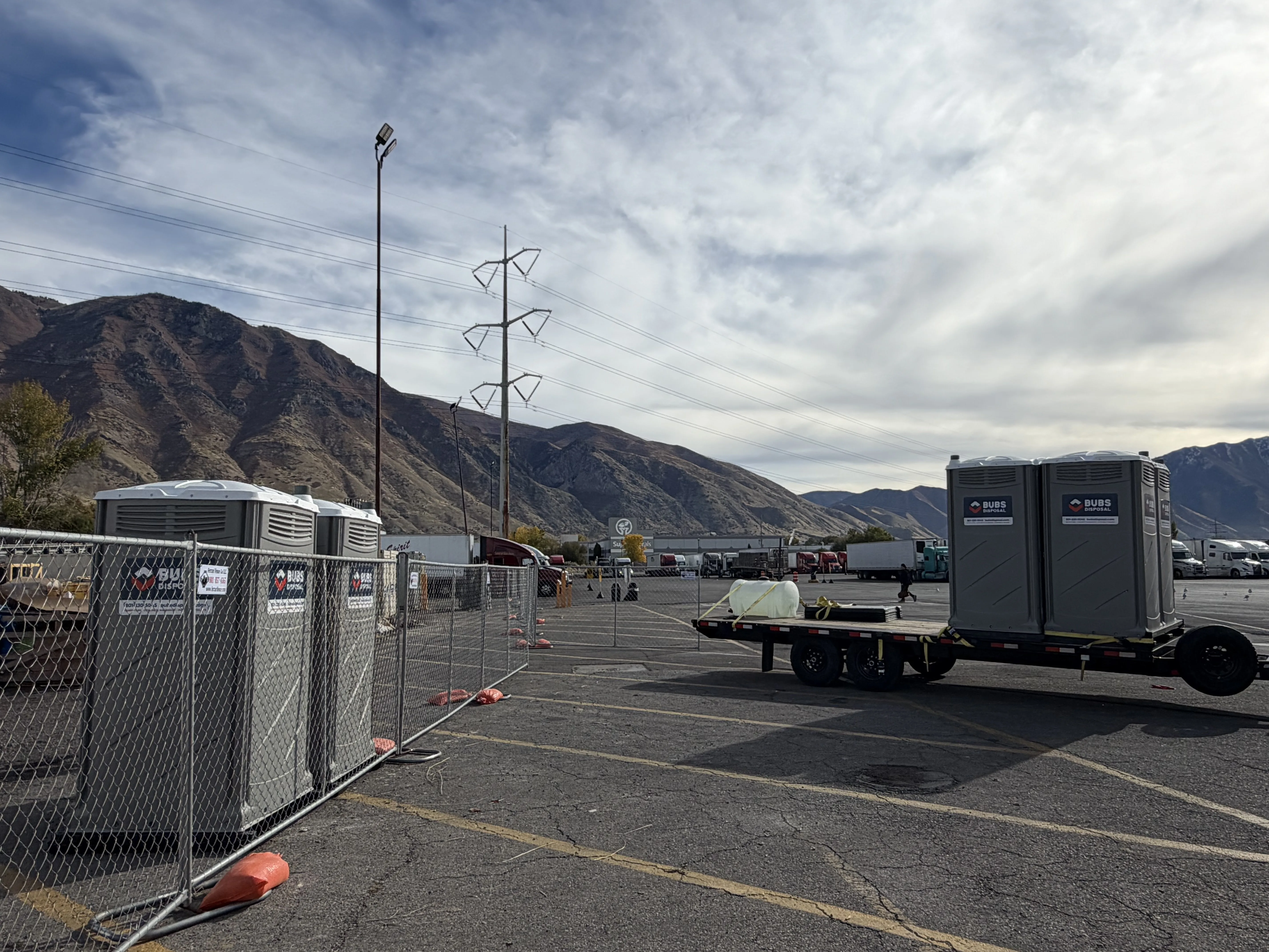 Bubs Disposal portable toilets staged for an event with Wasatch mountains in the background