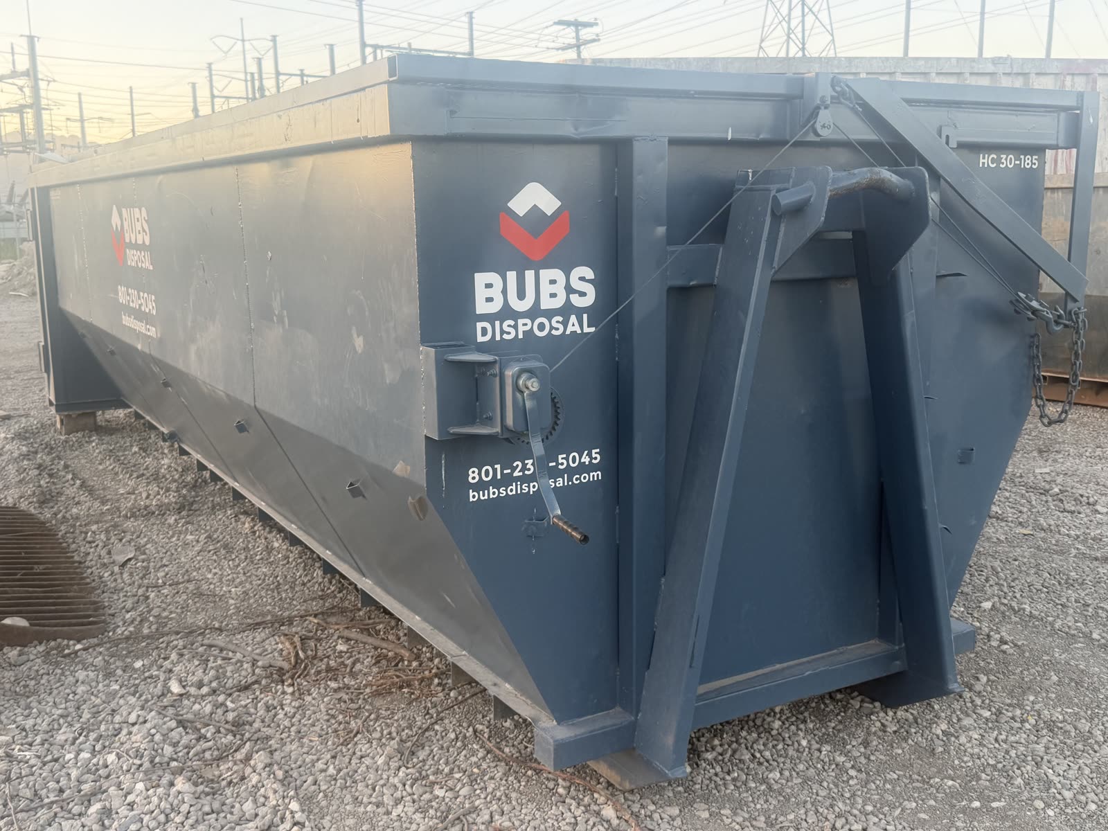 Bubs Disposal 30 yard covered dumpster with the mesh cover closed in Salt Lake City